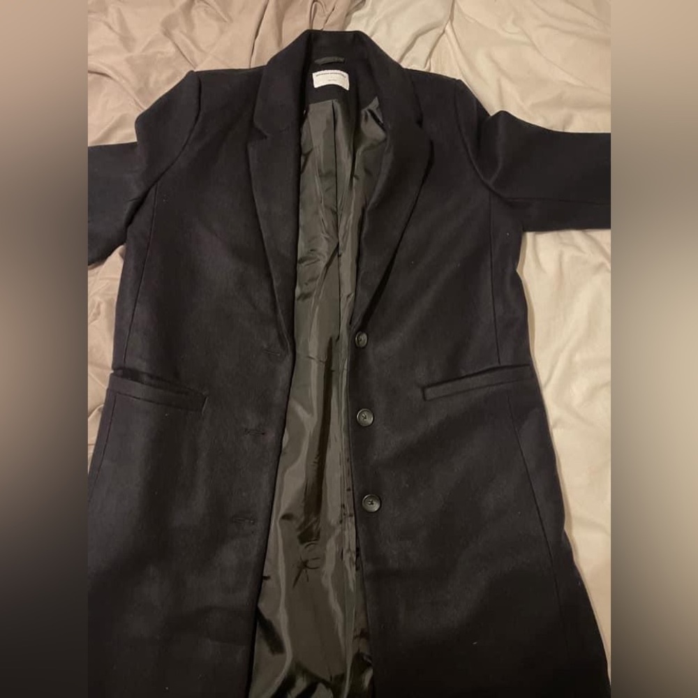 Large blazer black coat.